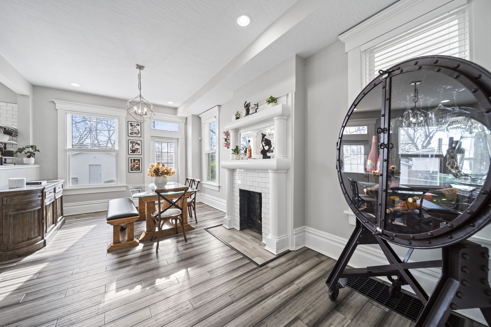 Light-filled dining room with statement wine cabinet